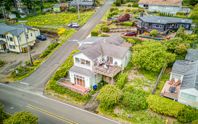 Aerial image of homes, including a green one with two entrances