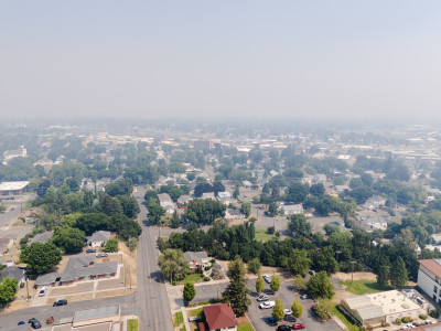 Aerial view of a community that is covered with smoky haze