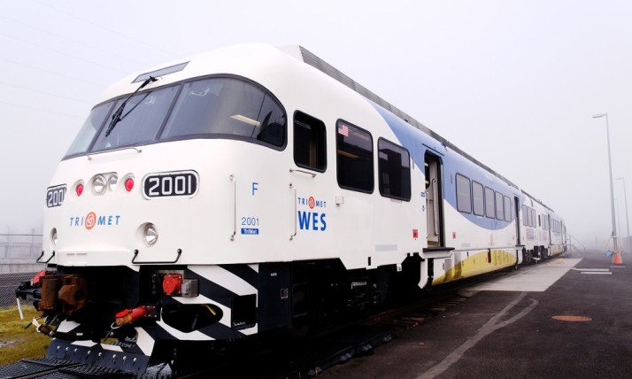 A photo show the front of a WES commuter train on a foggy day