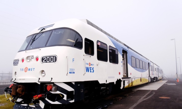 A photo show the front of a WES commuter train on a foggy day