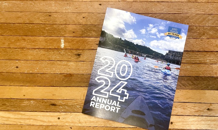 Cover of the 2024 annual report sitting on a wooden table