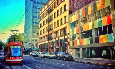 Portland Streetcar passes by multi-story buildings