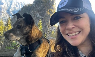 Julia Metz with dog in forest 