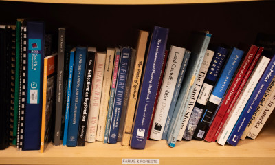 A shelf full of books about land use