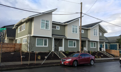 A row of townhomes with slanting roofs