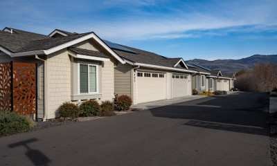 Row of duplexes with arid hills beyond