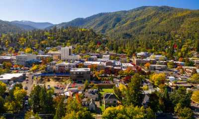 Aerial view of a town ringed by forested hills