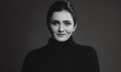 Black and white photo of a woman in a black turtleneck