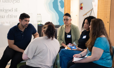 A group of people in focused discussion